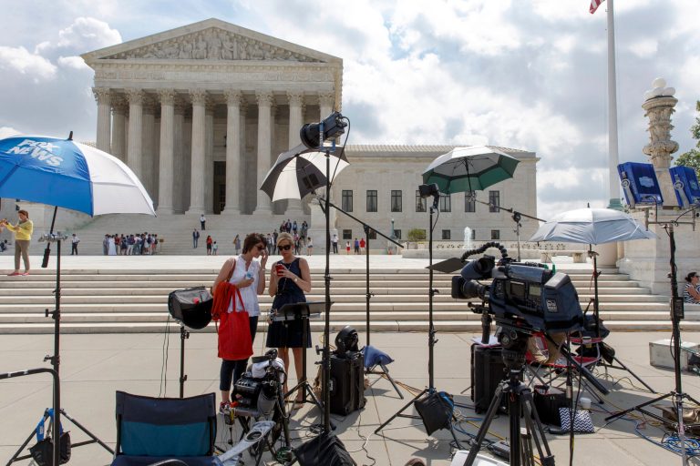 News media crews wait for decisions in the final days of the Supreme Court's term Wednesday. (AP/J. Scott Applewhite)