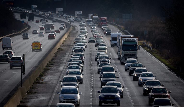 Traffic backs up behind a convoy transporting the fuselage and other parts of a Boeing 747 along the M4 motorway on February 14, 2015 near Bristol, England. (Photo by Matt Cardy/Getty Images)