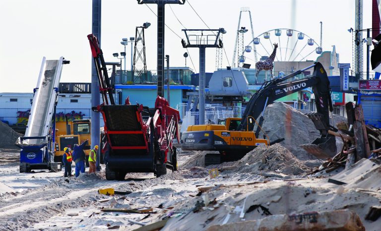 Crews work work to replace the Superstorm Sandy destroyed boardwalk in Seaside Heights, N.J., Thursday, Jan. 3, 2013. Under intense pressure from angry Republicans, House Speaker John Boehner has agreed to a vote this week on aid for Superstorm Sandy recovery. (AP Photo/Mel Evans)