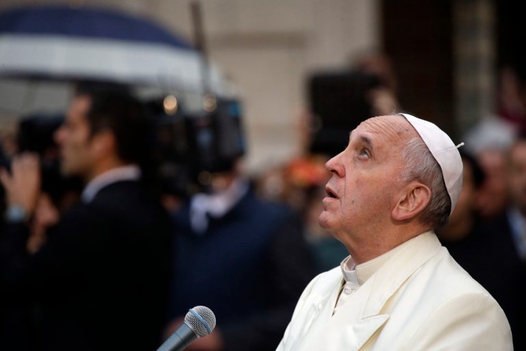 Pope Francis prays in front of the statue of the Virgin Mary, on the occasion of the Immaculate Conception feast, in Rome on Sunday. (AP Photo/Gregorio Borgia)