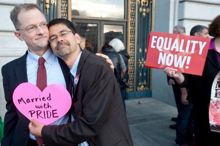 John Lewis, left, and Stuart Gaffney embrace outside San Francisco's City Hall shortly before the U.S. Supreme Court ruling cleared the way for same-sex marriage in California on Wednesday. (AP/Noah Berger)