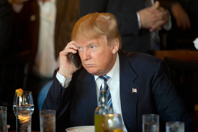 Exactly 50 percent of people want Trump to put down the phone. (AP Photo/Matt Rourke)