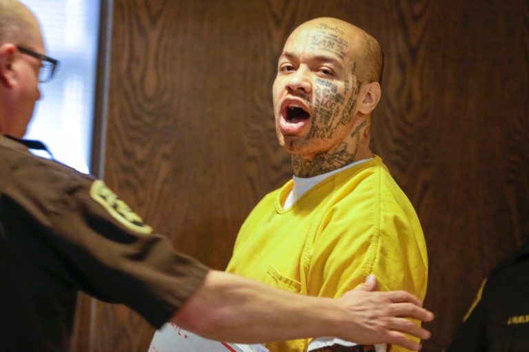 In this file photo from April 16, 2014, Nikko Jenkins is led by a Douglas County deputy in Omaha, Neb. (AP Photo/Nati Harnik, File)