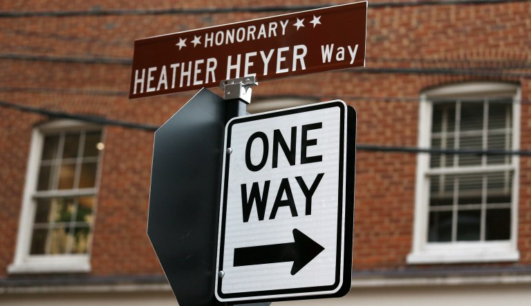 A newly placed street sign is seen shortly before a ceremony dedicating the street to Heather Heyer, the woman who was killed on Aug. 12 when a car drove through a crowd of people protesting a white nationalist rally in Charlottesville, Va. (Zack Wajsgras/The Daily Progress via AP)