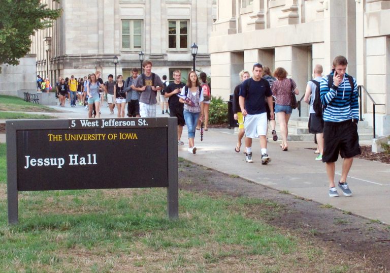   In this 2012 photo students walk between classes on campus at the University of Iowa in Iowa City, Iowa. The university announced Wednesday, Dec. 12, 2012, that its new application will include optional questions about sexual orientation and gender identity, making it the first public university to include such questions on an application. Elmhurst College, a private school in Illinois, became the first U.S. college to include similar questions last year. (AP Photo/Ryan J. Foley)  