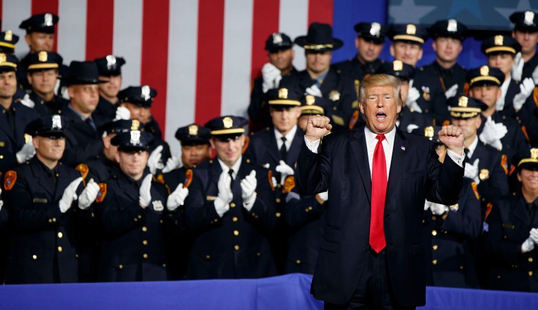 Today Trump made a good joke. And the cops were right to laugh. (AP Photo/Evan Vucci)