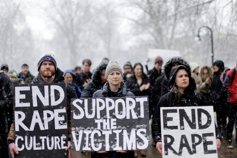 Students and others demonstrate on the Penn State campus in support of women police say were depicted on Kappa Delta Rho fraternity's private Facebook pages, Friday, March 20, 2015, in State College, Pa. (AP Photo/Matt Rourke)