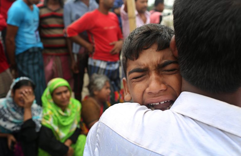 A Bangladeshi boy cries for his mother, missing after a ferry they were travelling in capsized in the River Padma in Munshiganj district, Bangladesh, Tuesday, Aug. 5, 2014. Rescuers were struggling Tuesday to locate a sunken ferry that was overloaded and carrying hundreds of passengers when it capsized in the river in central Bangladesh, leaving at least two people dead and probably many more. (AP Photo/A.M. Ahad)