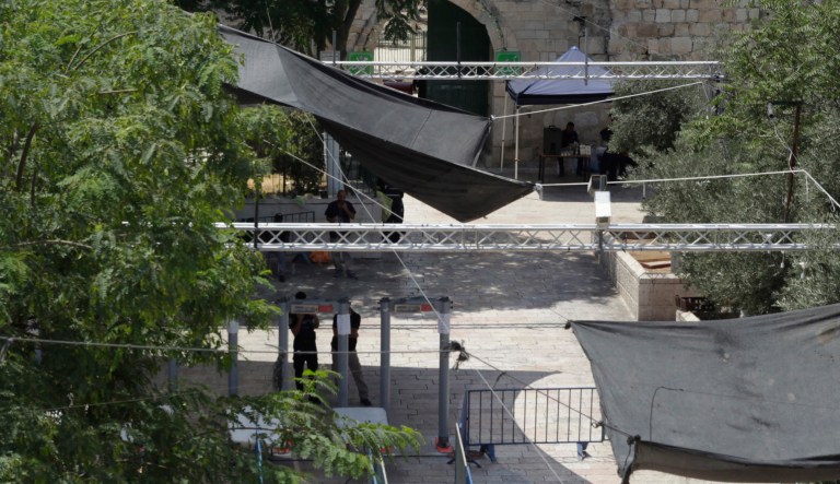 Israeli border police officers stand guard near newly installed cameras at the entrance to the Al Aqsa Mosque compound in Jerusalem's Old City, Sunday, July 23, 2017. (AP Photo/Mahmoud Illean)