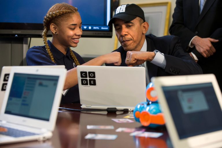 President Obama does a fist bump with Adrianna Mitchell during an 