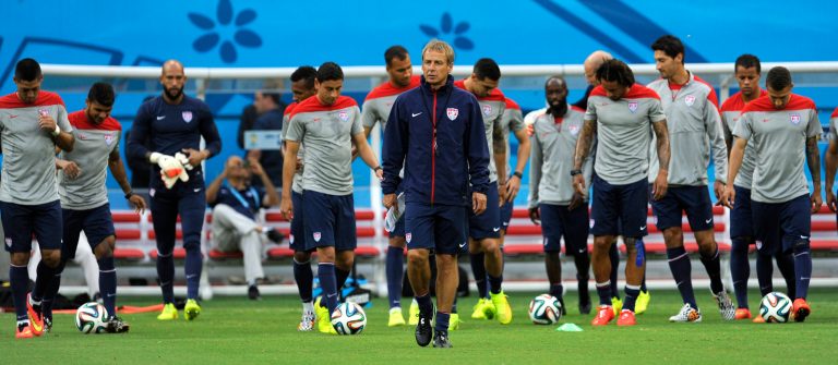 United States' Jurgen Klinsmann, center, walks on the pitch with his team during a training session at the Arena da Amazonia in Manaus, Brazil, Sunday, June 22, 2014. The U.S. will play Portugal in group G of the 2014 soccer World Cup on June 22. (AP Photo/Paulo Duarte)