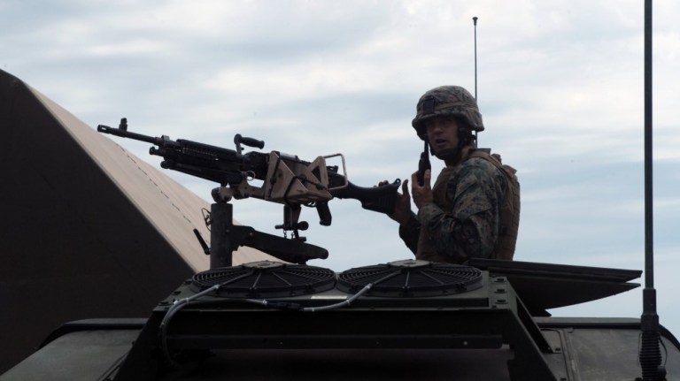 Cpl. Mitchell Dean Staats prepares to demonstrate convoy operations to Soldiers from the Ukrainian Army and Romanian Army at Babadag training area, Romania, June 16, 2010 as part of the Black Sea Rotational Force Security Cooperation Marine Air-Ground Task Force.