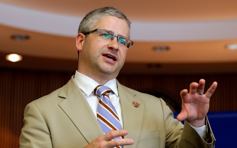 In this photo taken Aug. 5, 2013, Rep. Patrick McHenry speaks to a full house during a town hall meeting in Lincolnton, N.C. 