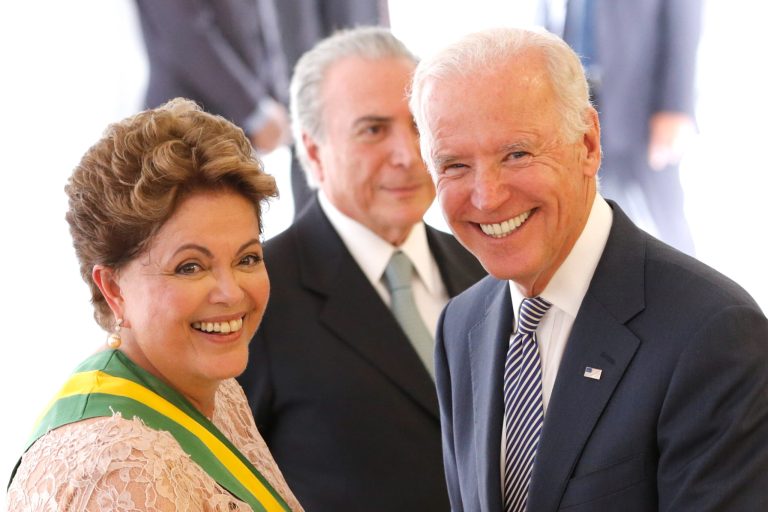 Brazil's President Dilma Rousseff, left, smiles with U.S. Vice President Joe Biden, during President Rousseff's inauguration, at the Planalto Presidential Palace in Brasilia, Brazil, Thursday, Jan. 1, 2015. (AP Photo/Eraldo Peres)