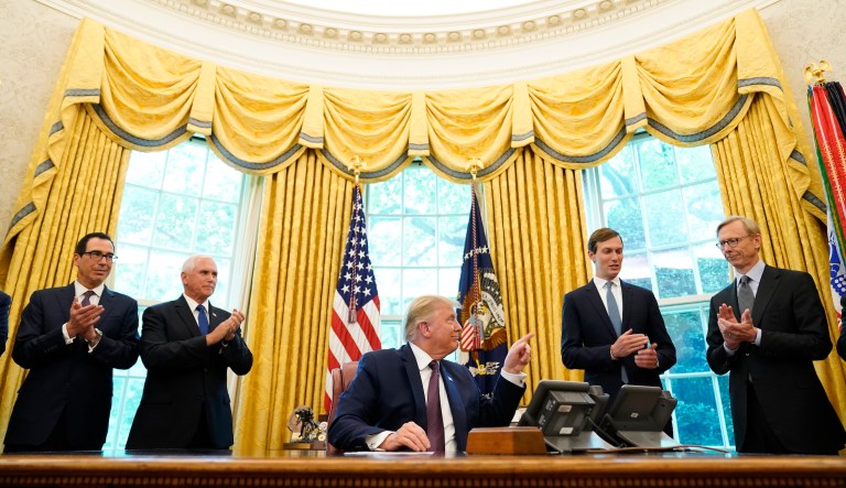 President Donald Trump speaks in the Oval Office of the White House on Friday, Sept. 11, 2020, in Washington. Bahrain has become the latest Arab nation to agree to normalize ties with Israel as part of a broader diplomatic push by Trump and his administration to fully integrate the Jewish state into the Middle East. From left, Treasury Secretary Steven Mnuchin, Vice President Mike Pence, Trump, Jared Kushner and U.S. special envoy for Iran Brian Hook.