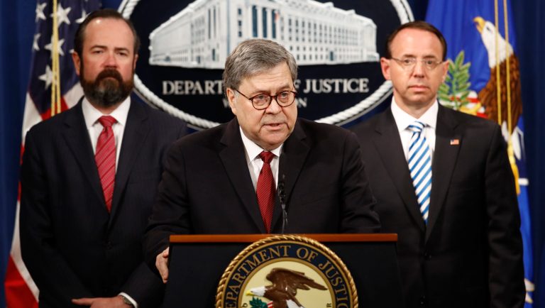 Attorney General William Barr speaks alongside Deputy Attorney General Rod Rosenstein, right and Deputy Attorney General Ed O'Callaghan, left, about the release of a redacted version of special counsel Robert Mueller's report during a news conference, Thursday, April 18, 2019, at the Department of Justice in Washington. 