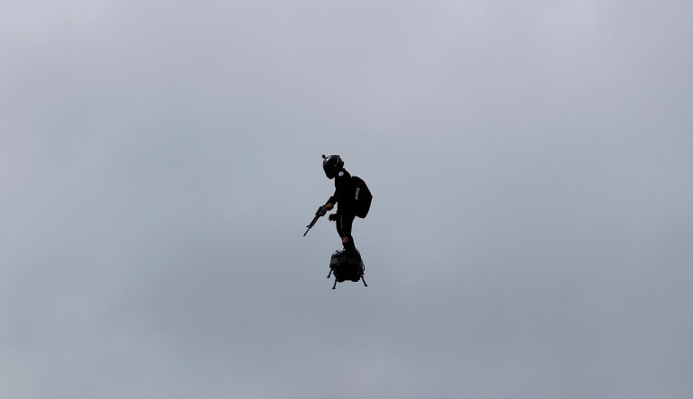 A French soldier on a hoverboard is pictured during Bastille Day parade Sunday, July 14, 2019 on the Champs Elysees avenue in Paris.