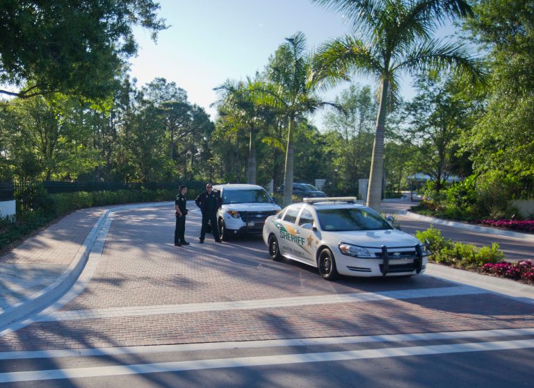 Police vehicles are seen outside the entrance of the Floridian National Gold Golf Course, Sunday, March 29, 2015, in Palm City, Florida. President Barack Obama is spending the weekend here and is returning to Washington later tonight. (AP Photo/Pablo Martinez Monsivais)