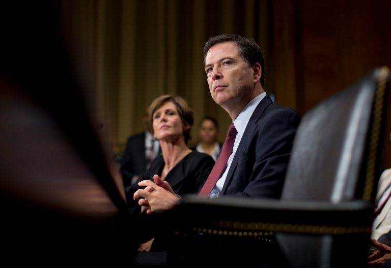 FBI Director James Comey, joined by Deputy Attorney General Sally Quillian Yates, pauses as he testifies during the Senate Judiciary Committee hearing on Capitol Hill in Washington, Wednesday, July 8, 2015. (AP Photo/Carolyn Kaster)