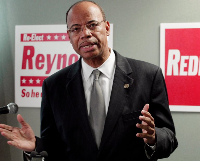 FILE - In this Nov. 28, 2012, file photo, former U.S. Rep. Melvin Reynolds announces that he's joining the increasingly crowded field running for the 2nd District seat vacated by Jesse Jackson Jr. A Zimbabwean immigration official told The Associated Press, Tuesday, Feb. 18, 2014, that Reynolds has been arrested in the African country and is being investigated. The state-controlled The Herald newspaper reported Tuesday that Reynolds was arrested for allegedly possessing pornographic material and violating immigration laws. (AP Photo/M. Spencer Green, File)