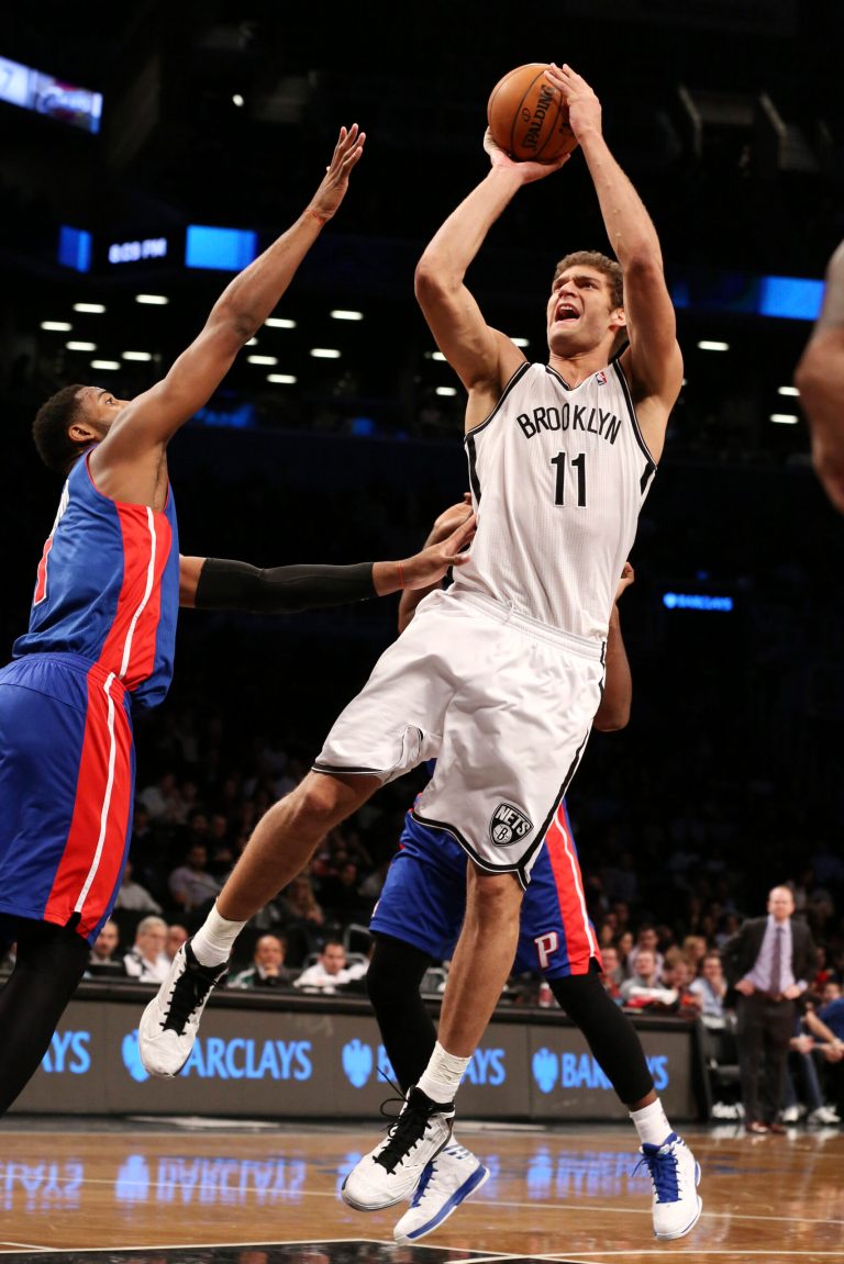   Brooklyn Nets center Brook Lopez (11) takes a jump shot in the first half of their NBA basketball game against the Detroit Pistons at Barclays Center, Friday, Dec. 14, 2012, in New York. (AP Photo/John Minchillo)  