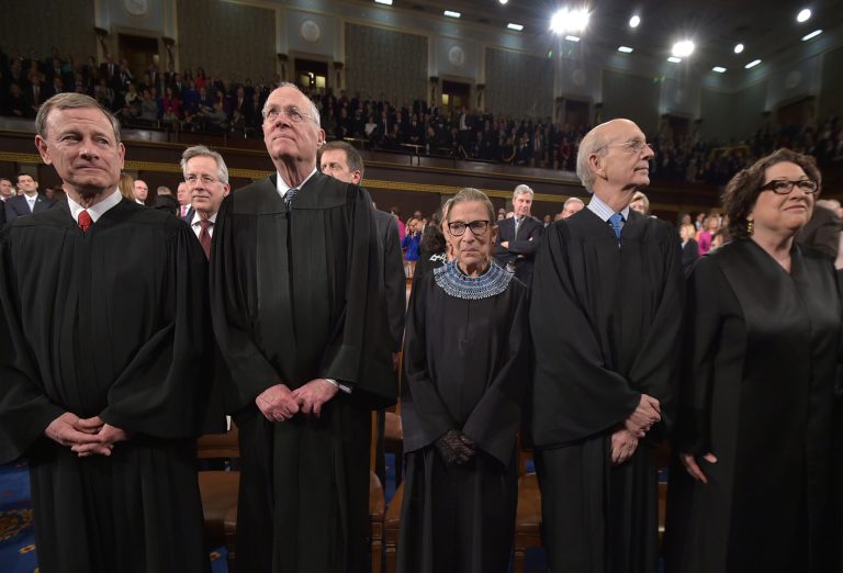 Five Supreme Court Justices stand prior to President Obama's State of the Union address on January 20, 2015. (Getty Images)