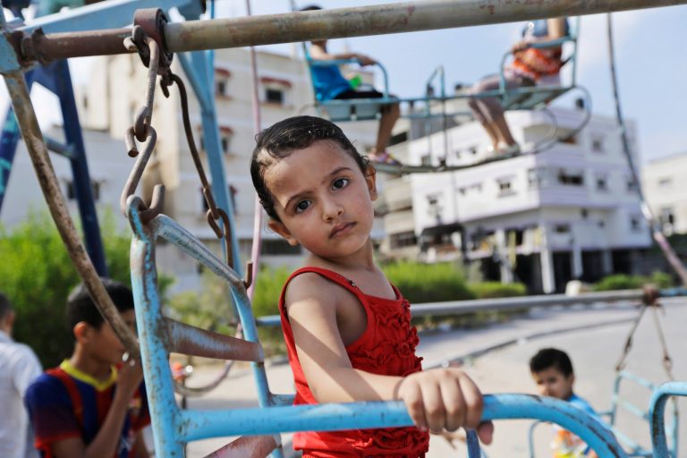 Palestinian May Amin, 2, rides a swing while celebrating on the first day of the Muslim festival of Eid al-Fitr in Gaza City, in the northern Gaza Strip, Monday, July 28, 2014. The Amin family, originally from the Shijaiyah neighborhood of Gaza City, moved in with relatives in another part of town because of heavy Israeli strikes in heir area. As Muslims began celebrating the Eid al-Fitr holiday on Monday that marks the end of the fasting month of Ramadan, there was mostly fear and mourning instead of holiday cheer in the Gaza Strip. (AP Photo/Lefteris Pitarakis)