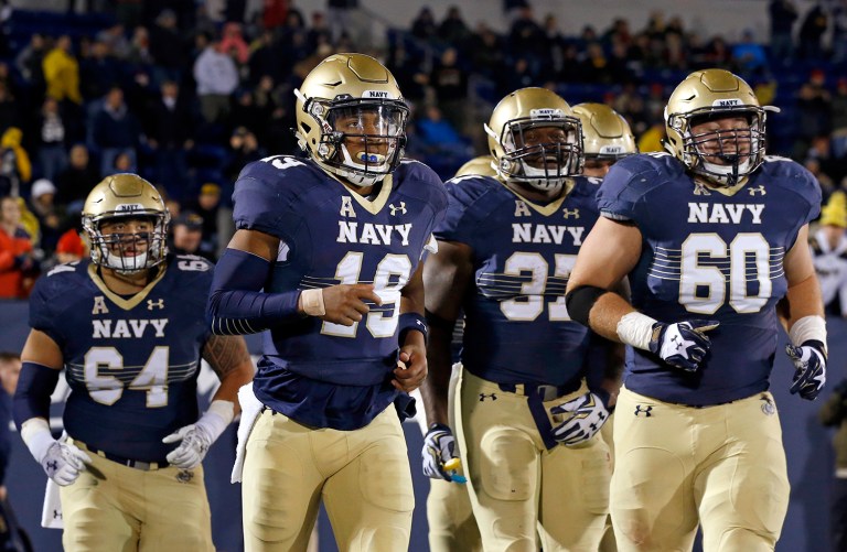 The policy was eased last year after a talented Navy midshipman, Keenan Reynolds, was recruited by the Baltimore Ravens football team. (AP Photo/Patrick Semansky)