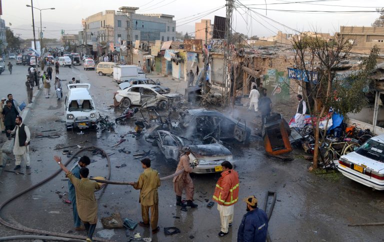 Pakistani firemen gather at the site of a bomb blast in a market in Quetta, Pakistan, Wednesday, Oct. 30, 2013. The attack occurred in the capital of Baluchistan province, home to both Islamic militants and separatists who have waged a low-level insurgency against the government for decades. (AP Photo/Arshad Butt)