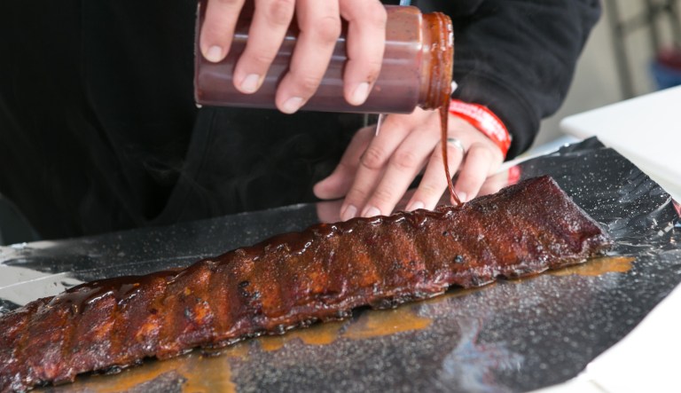 Rib entry is prepared during the 2nd annual Kingsford Invitational, taking place this Veterans Day weekend at the Intrepid Sea, Air & Space Museum on Saturday, November 9, 2013 in New York, NY.