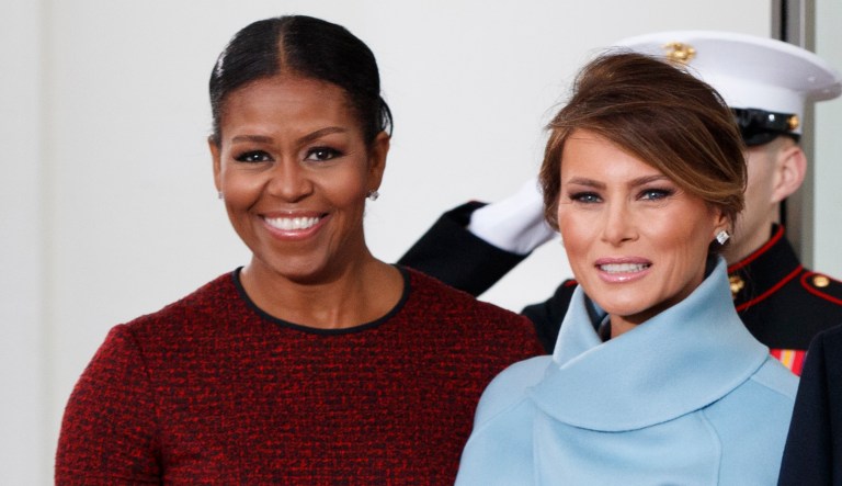 Where Michelle Obama is adorned with praise for her fashion and actions, Melania Trump is derided for just the same. (AP Photo/Evan Vucci)