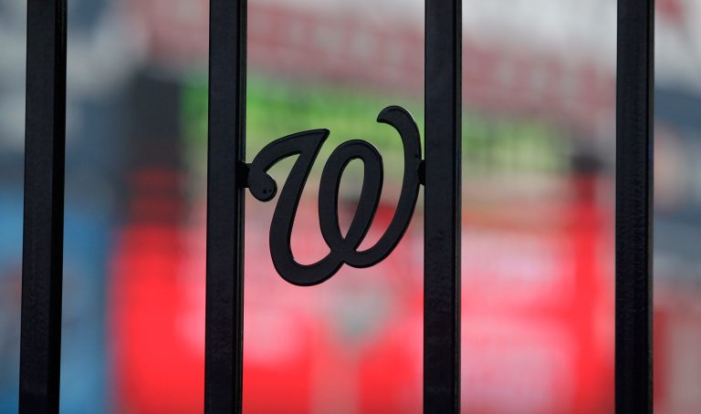 WASHINGTON, DC - MARCH 31:  The Washington Nationals logo is shown on the fence entering the park at Nationals Park before the start of the Atlanta Braves and Washington Nationals opening day game on March 31, 2011 in Washington, DC.  (Photo by Rob Carr/Getty Images)