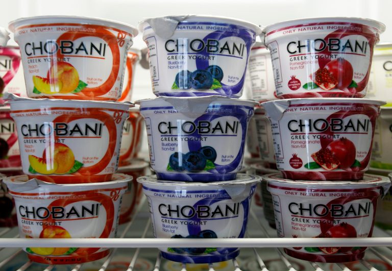 FILE - This Jan. 13, 2012 file photo shows cups of Chobani Yogurt at Chobani Greek Yogurt in South Edmeston, N.Y. Team USA sponsor Chobani, which is based in upstate New York, says it has 5,000 cups of Greek yogurt sitting in a refrigerated warehouse waiting to be flown to the Olympic village. But Russian authorities say the U.S. Department of Agriculture has refused to provide a certificate that is required for dairy products under its customs rules. A U.S. Department of Agriculture spokeswoman says the agency is working with its Russian counterpart to reach a solution to allow the Chobani shipment to go through despite the lack of agreement on general trade requirements for dairy products.(AP Photo/Mike Groll, File)