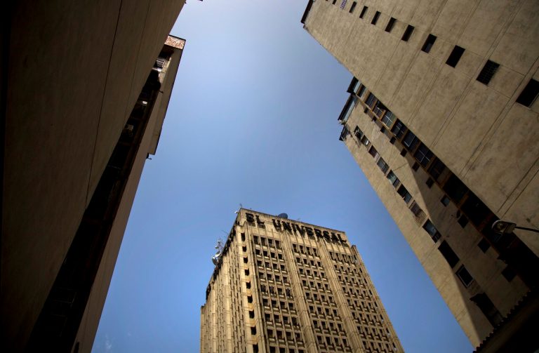A skyward view of the El Universal newspaper headquarters, in downtown Caracas, Venezuela, Friday, July 4, 2014. El Universal, one of Venezuela's most prestigious newspapers has been sold, Editor in Chief Elides Rojas confirmed. Details of the sale of Caracas-based El Universal to a group of Spanish investors were still emerging Friday. (AP Photo/Ramon Espinosa)