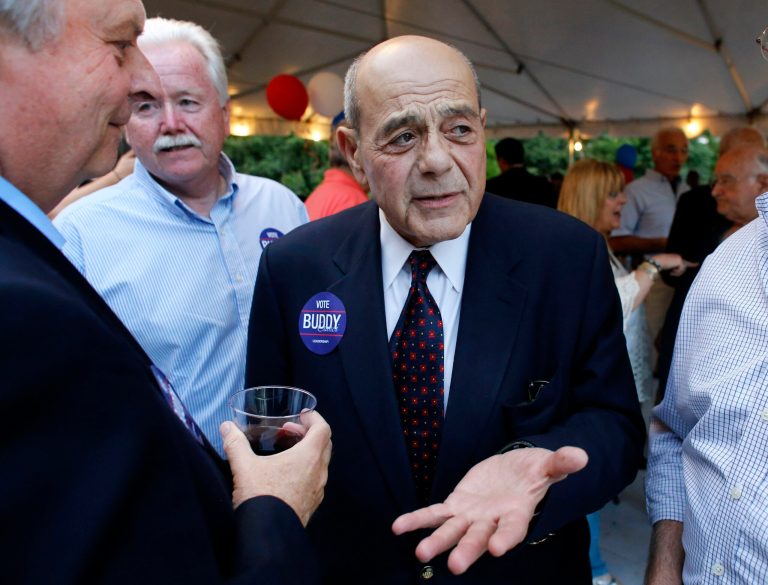 FILE - In this Sept. 10, 2014, file photo, former Providence Mayor Buddy Cianci, center, speaks with supporters, including assistant city solicitor Kevin McHugh, holding wine glass at left, during a fundraising event in Providence, R.I.  Cianci accepted campaign contributions from dozens of city employees, including a $125 contribution from McHugh, in his comeback bid for City Hall despite pledging not to, according to campaign finance reports filed Tuesday. (AP Photo/Steven Senne, File)