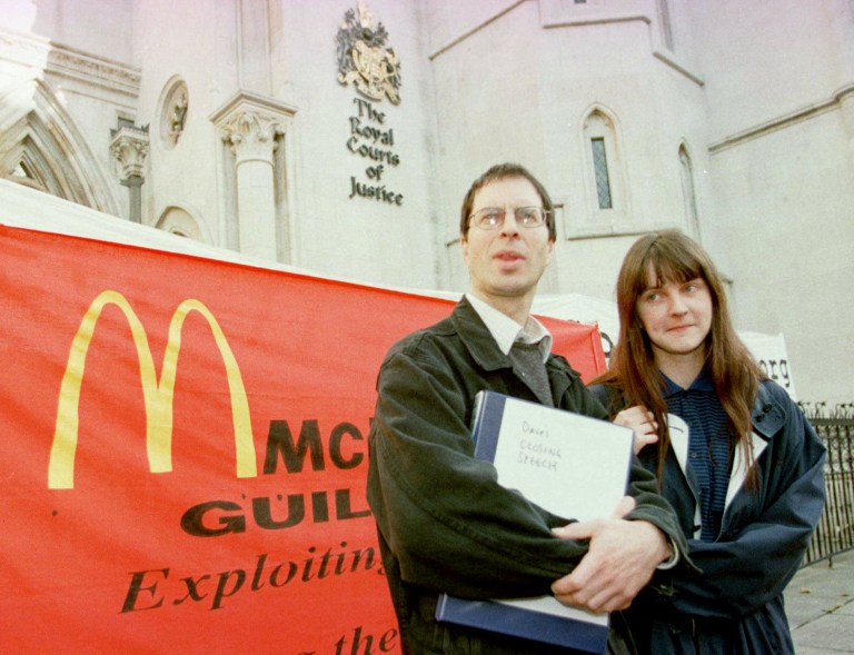 Activists Dave Morris, left, and Helen Steel, right, stand outside of the Royal Courts of Justice in London where they are involved in a libel case against McDonald's Corporation Monday, October 21, 1996.  A new book has revealed that an undercover London cop helped write an anti-McDonalds leaflet for a Greenpeace group that sparked the longest-running libel case in British legal history. (AP Photo/Lynne Sladky)