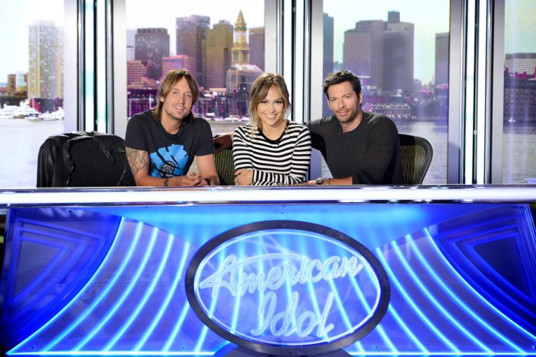   This 2013 publicity photo released by FOX shows judges, from left, Keith Urban, Jennifer Lopez and Harry Connick Jr. for FOX's 