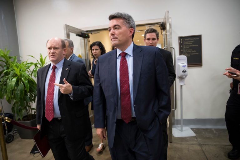 Senate Foreign Relations Committee members Sen. Chris Coons, D-Del., left and Sen. Cory Gardner, R-Colo. arrive on Capitol Hill Washington, Wednesday, Aug. 2, 2017, for a closed-door meeting with Secretary of State Rex Tillerson and Defense Secretary James Mattis. Earlier, President Donald Trump signed a bill to impose new sanctions on Russia which passed Congress with overwhelming support. (AP Photo/J. Scott Applewhite)