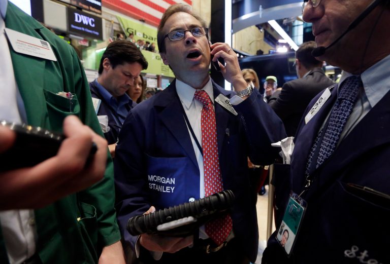 Trader Dudley Devine, center, works on the floor of the New York Stock Exchange, Friday, July 18, 2014. U.S. stocks are opening higher after Google, Honeywell and other big companies report their quarterly results. (AP Photo/Richard Drew)
