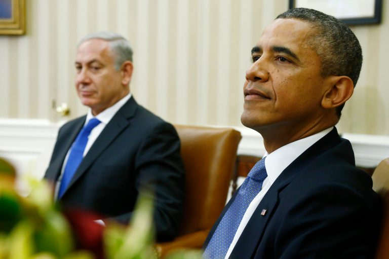 President Barack Obama and Israeli Prime Minister Benjamin Netanyahu wait for reporters and cameramen to get in place before they make statements in the Oval Office of the White House in Washington, Monday, Sept. 30, 2013. (AP Photo/Charles Dharapak)