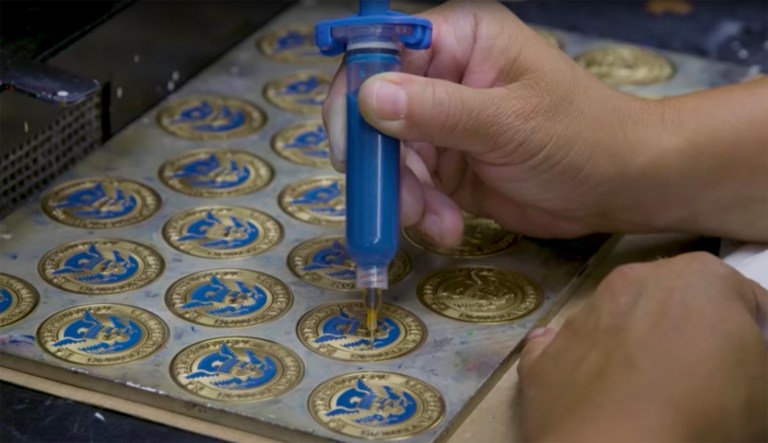 The video from the president's re-election campaign features one apprentice, two employees and the CEO of Medalcraft Mint. (Donald J. Trump for President/YouTube)