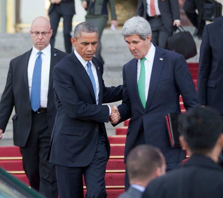 President Obama, left, and U.S. Secretary of State John Kerry shake hands outside the Great Hall of the People in Beijing Wednesday, Nov. 12, 2014. (AP Photo/Pablo Martinez Monsivais)