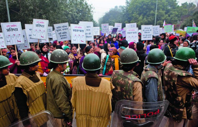 Indian paramilitary women stand guard during a march to mourn the death of a gang rape victim in New Delhi, India, Wednesday, Jan. 2, 2013. India's top court says it will decide whether to suspend lawmakers facing sexual assault charges as thousands of women gathered at the memorial to independence leader Mohandas K. Gandhi to demand stronger protection for their safety. (AP Photo/ Dar Yasin)