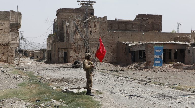 A Pakistani army soldier stands guard in Miran Shah bazaar after driving out militants from Pakistan's tribal region of North Waziristan along the Afghanistan border, Wednesday, July 9, 2014. (AP Photo/Rebecca Santana)
