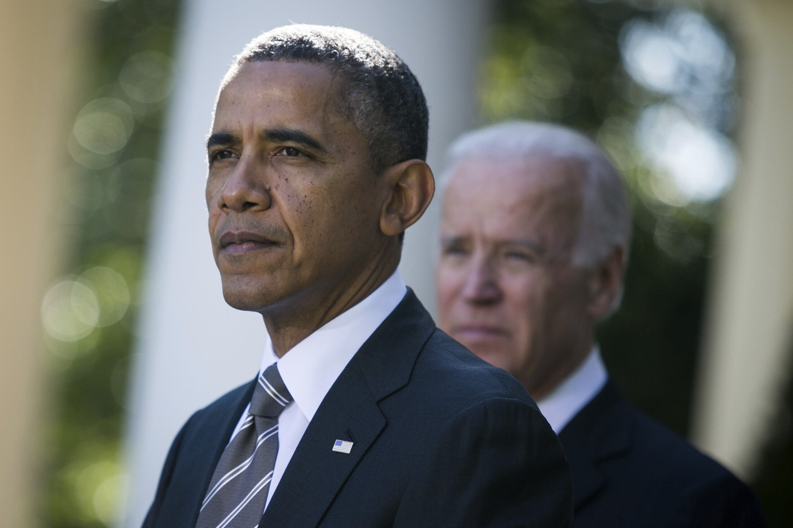 Obama pulls Joe Biden close after harsh criticism from Robert Gates