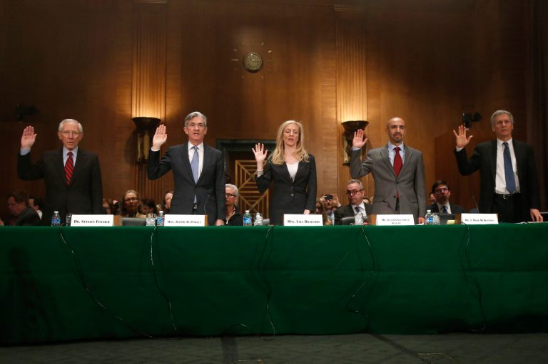 Nominees, from left: Stanley Fischer, to be vice chairman of the Federal Reserve Board of Governors; Jerome H. Powell and Lael Brainard, to be members of the Federal Reserve Board of Governors; Gustavo Velasquez Aguilar, to be an assistant secretary of the Department of Housing and Urban Development; J. Mark McWatters, to be a member of the National Credit Union Administration Board; raise their hands as they are sworn in on Capitol Hill in Washington, March 13,prior to their testifying before the Senate Banking Committee hearing on their nominations. (AP Photo/Charles Dharapak)