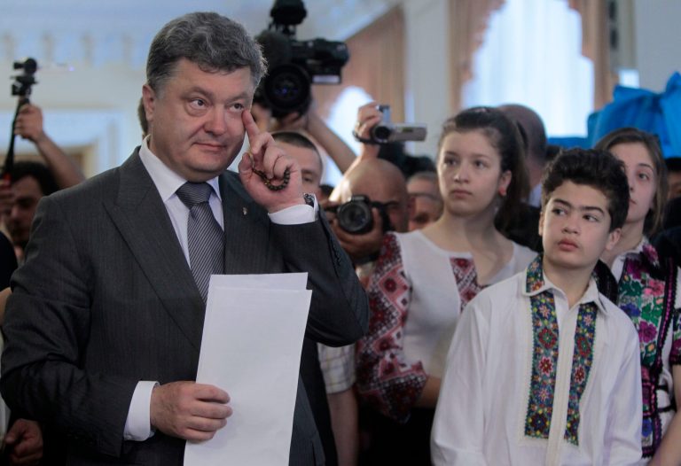 Ukrainian presidential candidate Petro Poroshenko, left, casts his ballot as his daughter Eugenia, son Mykhailo and daughter Alexandra look on at a polling station during the presidential election in Kiev, Ukraine, on Sunday. (AP/Sergei Chuzavkov)