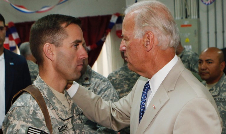 FILE - In this July 4, 2009 file photo, U.S. Vice President Joe Biden, right, talks with his son U.S. Army Capt. Joseph R. "Beau" Biden III at Camp Victory on the outskirts of Baghdad, Iraq. On May 30, 2015, Vice President Biden announced the death of son, Beau, two-time Delaware attorney general, from brain cancer. 