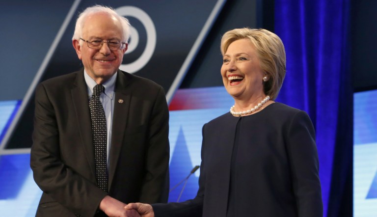 Democratic presidential candidates, Hillary Clinton and Sen. Bernie Sanders, I-Vt,  shake hands before the start of the Univision, Washington Post Democratic presidential debate at Miami-Dade College, Wednesday, March 9, 2016, in Miami, Fla.