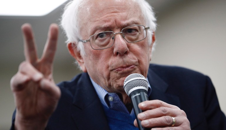 Second-choice Sanders goes on offensive to win voters from Biden
